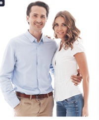 Couple posing together in studio.