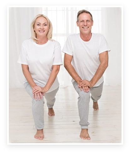A smiling couple performing lunges, representing an active and healthy lifestyle supported by Probiotics for Gut Health.