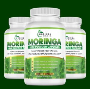 A bottle of Moringa Magic capsules displayed next to a detailed chart of Moringa Nutrition Facts.